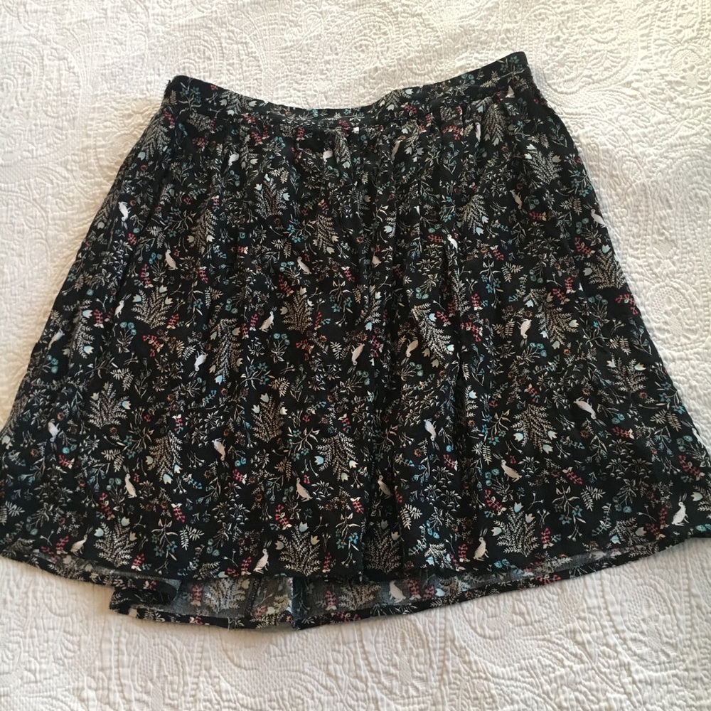 Black patterned skirt.
